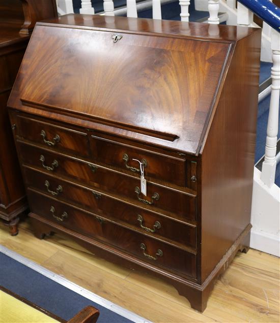 A reproduction mahogany bureau W.98cm